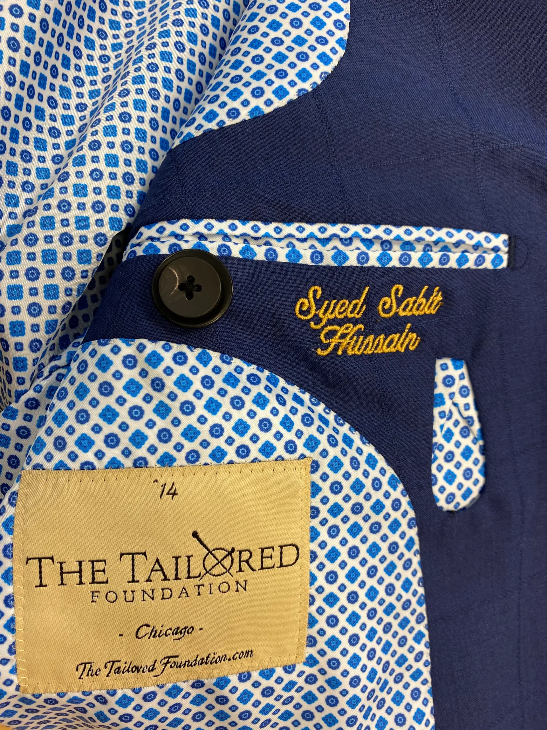 Monogrammed blue print blazer lining with The Tailored Foundation label