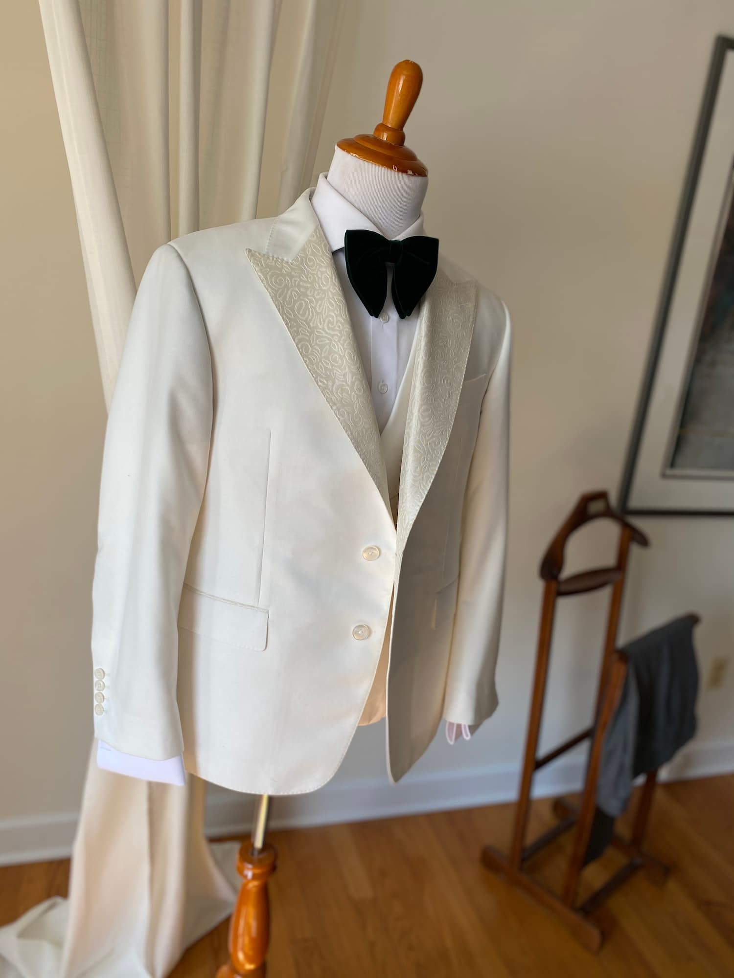 Ivory dinner jacket with shawl lapel and black bow tie