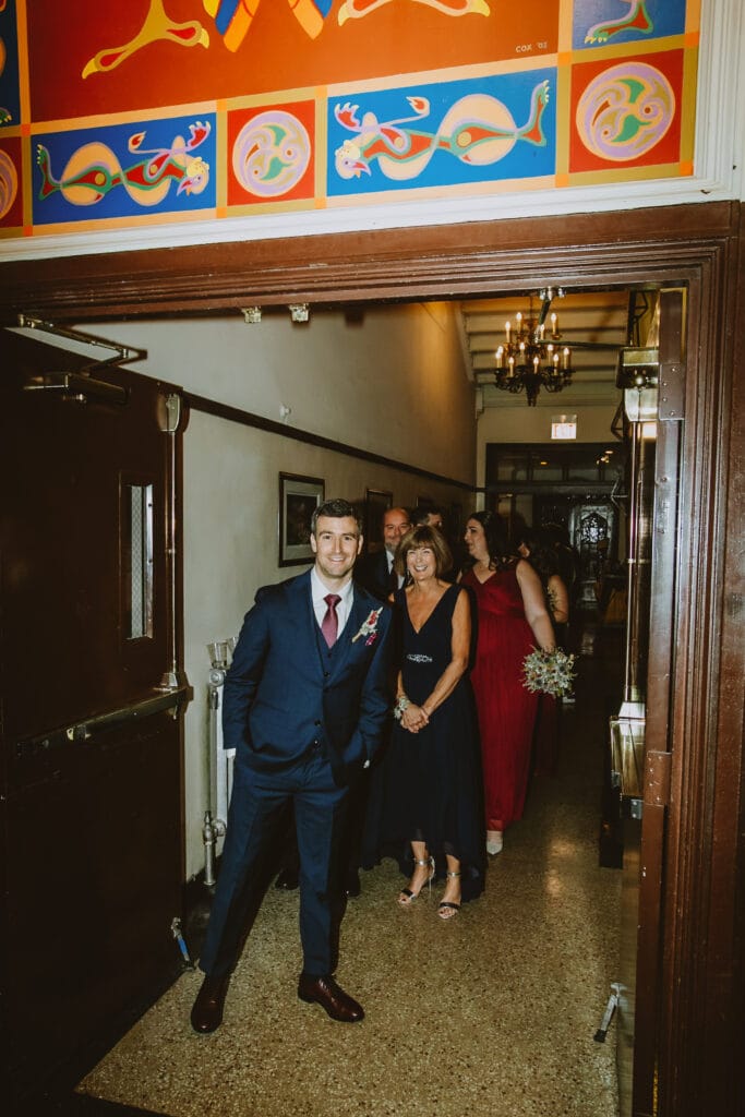 0297-20231111_1655_MN_MN_C2462 A man wearing a wedding suit