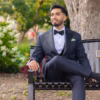 Man stting on Bench wearing custom suit