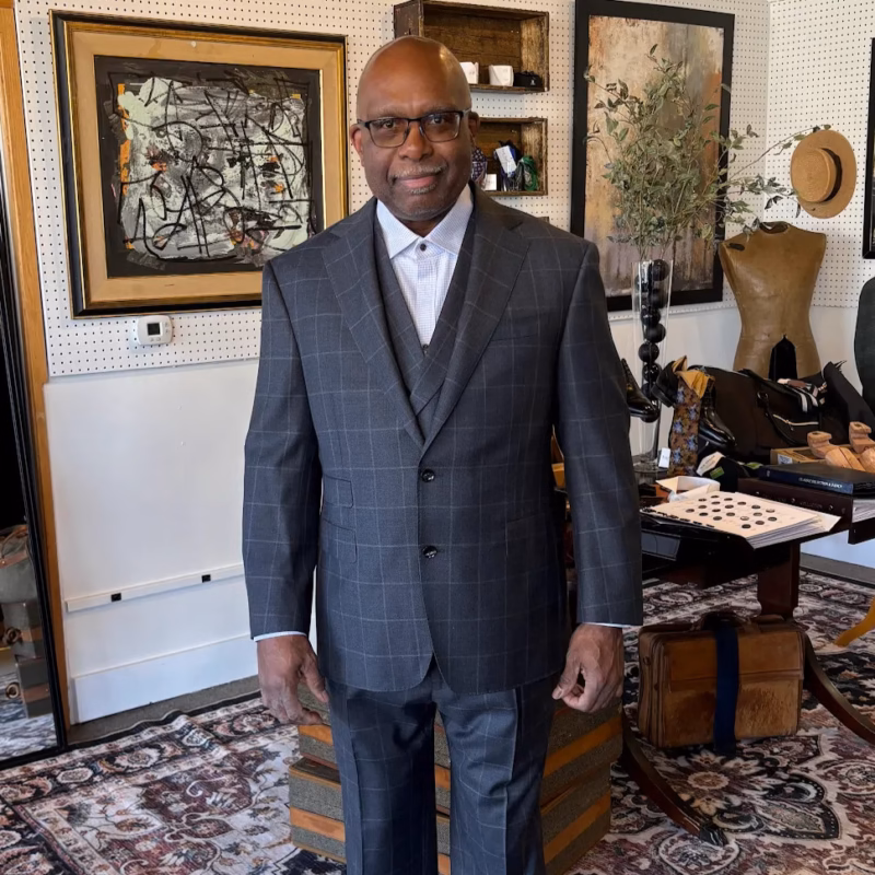 A man wearing a custom suit from the Tailored foundation